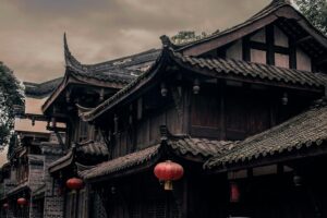 Traditional Chinese architecture with ornate roofs and red lanterns.